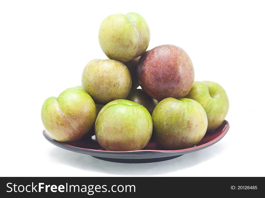 Stack of Chinese plums(Sanhua Plum) on white