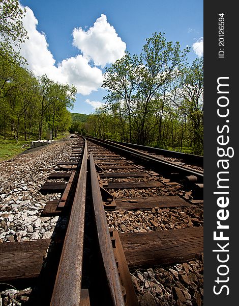 Railroad tracks running through a country setting. Railroad tracks running through a country setting