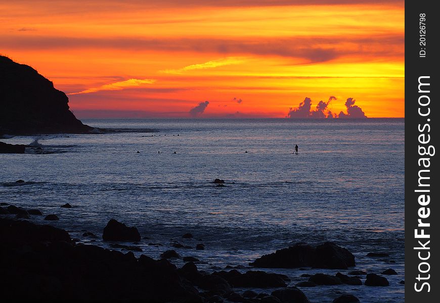 Spectacular Sunset Over Rocky Surfbeach