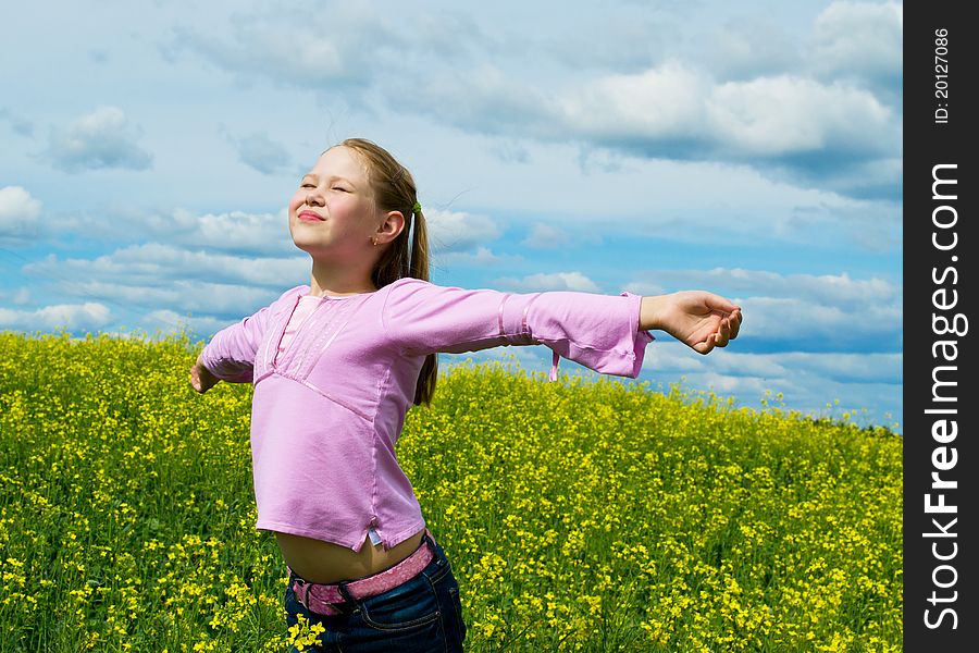 The young girl on a green meadow. The young girl on a green meadow