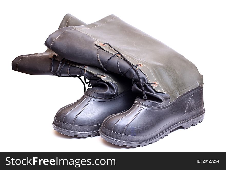 Color photograph of rubber boots on a white background