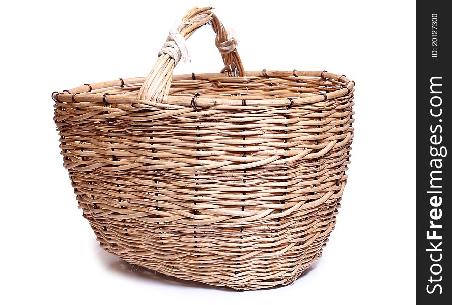 Color photo of wicker basket on a white background