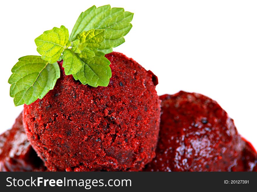 Ice cream made of forest fruits, decorated with mint, isolated on white