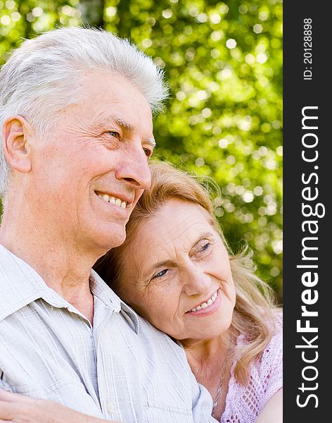 Happy elderly couple posing at the nature. Happy elderly couple posing at the nature