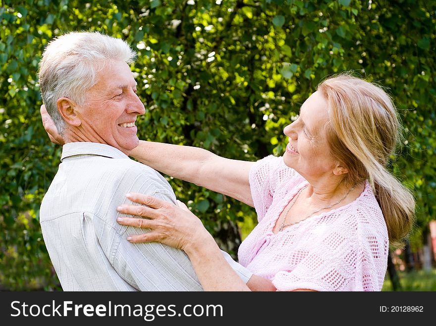 Happy aged couple dancing at the nature. Happy aged couple dancing at the nature