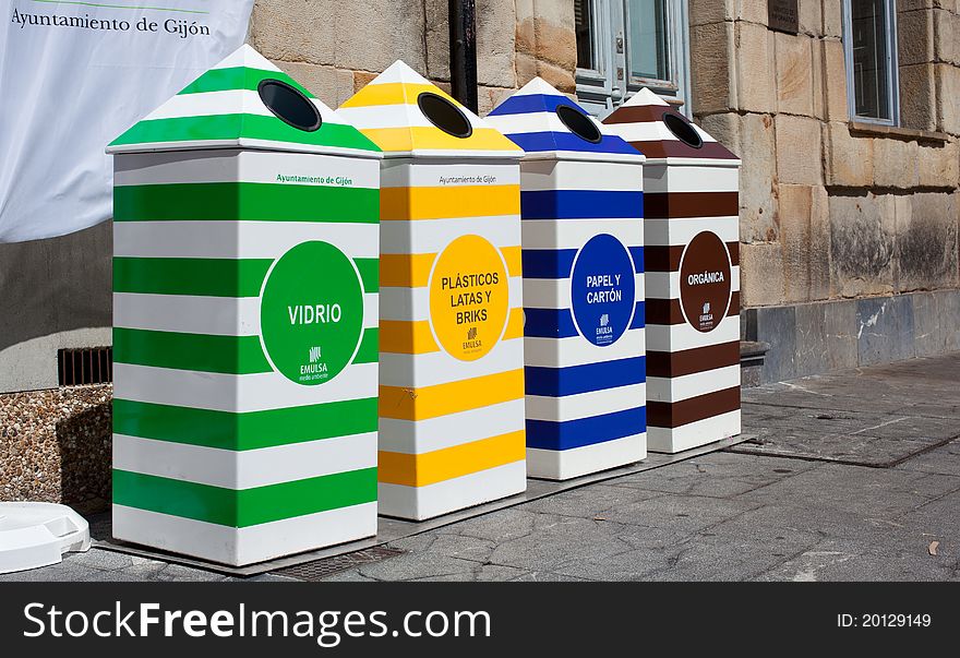 Four containers for recycling paper, metal, plastic and glass - Gijon, Asturias