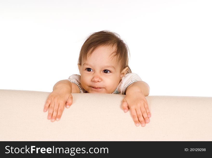 Portrait of a funny baby at sofa. Portrait of a funny baby at sofa