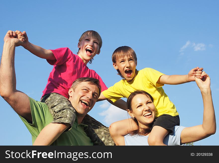 Happy family in color clothes at nature. Happy family in color clothes at nature