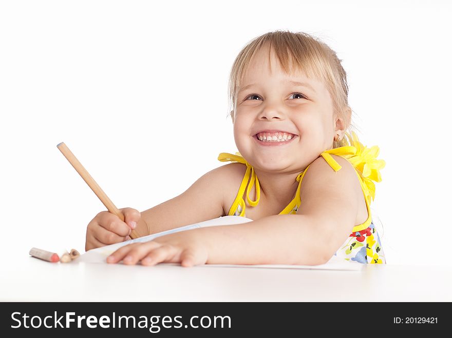 Little girl draws on a white background