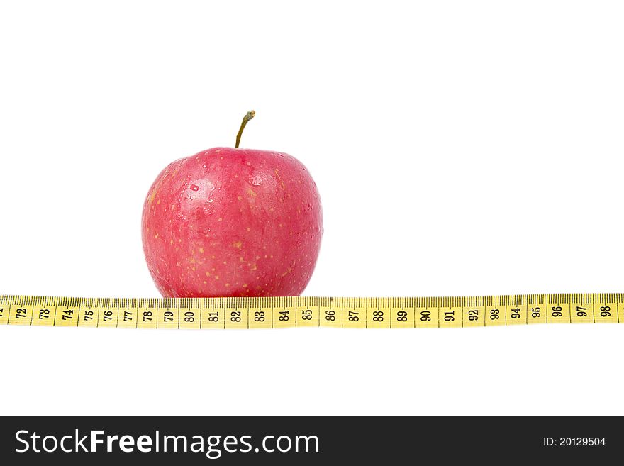 Isolated photo of apple with measurement tape. Isolated photo of apple with measurement tape