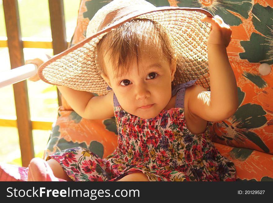 Cute little girl posing in a hat. Cute little girl posing in a hat