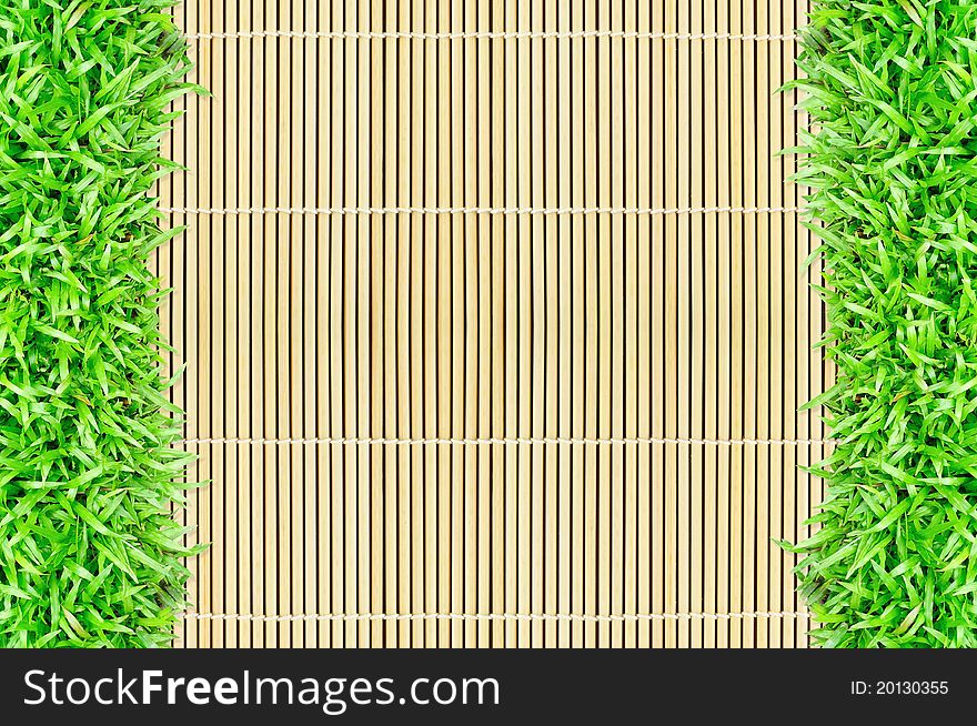 Grass frame on bamboo background