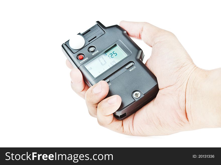 Hand holding lightmeter isolated on white background