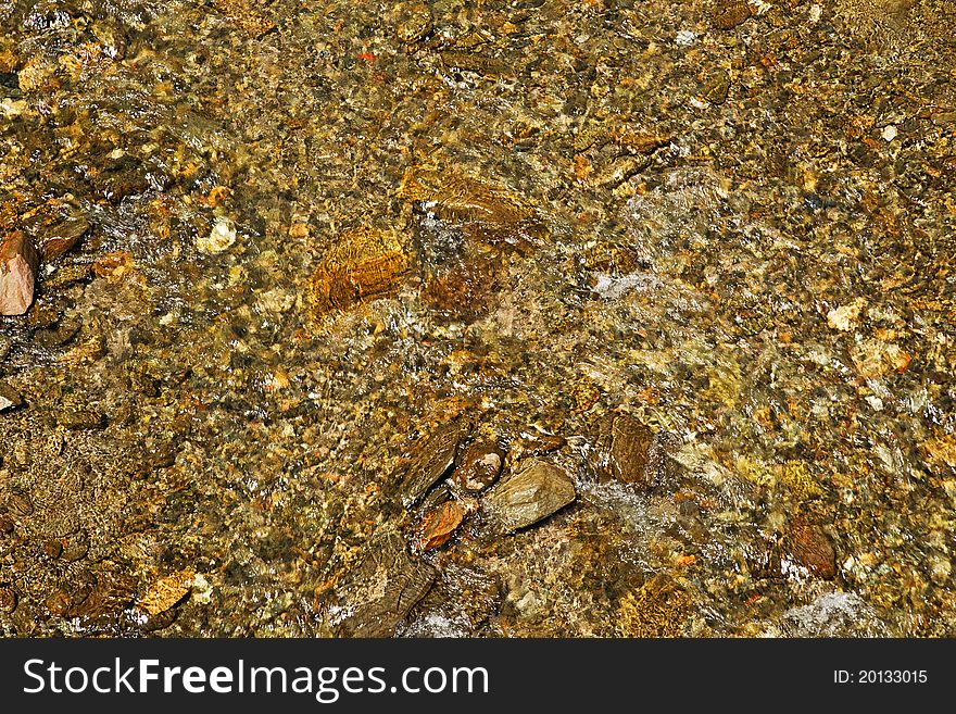 Mountain stream background. The running water.