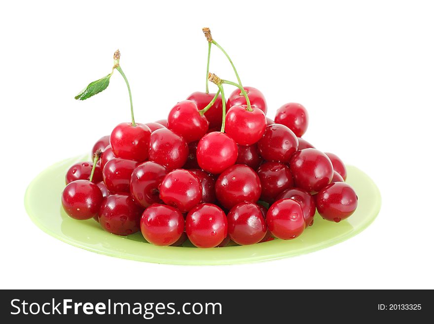 Red fresh cherries on green plate. Red fresh cherries on green plate