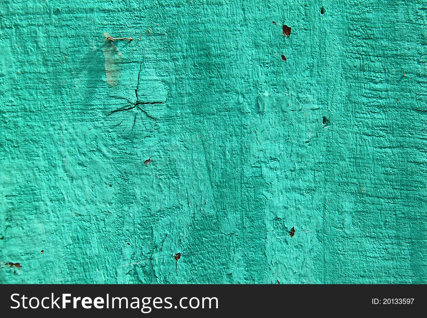 Background of a grunge green wooden wall. Background of a grunge green wooden wall