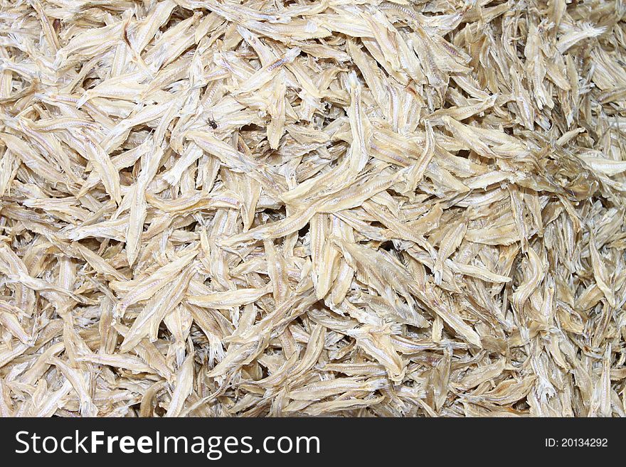 A picture of dried salted fishes in sunlight