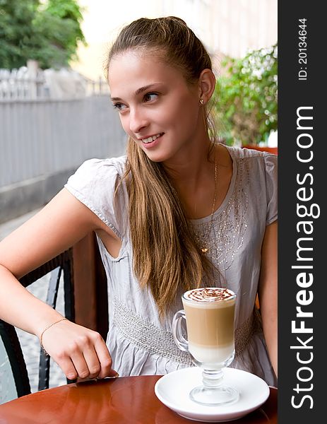 Woman with coffee in cafe