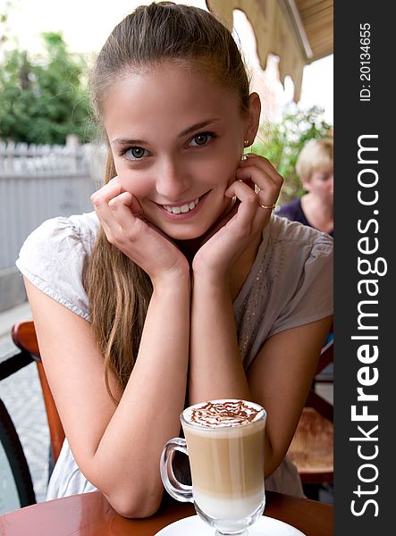 Woman with coffee in cafe