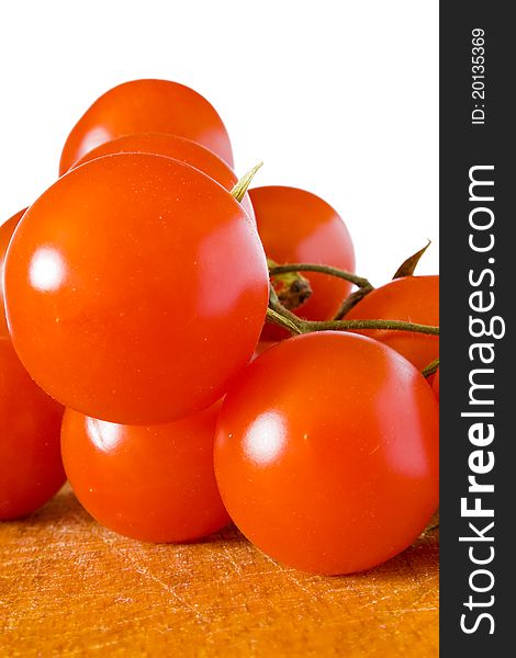 Closeup of cherry tomatoes on the wood table