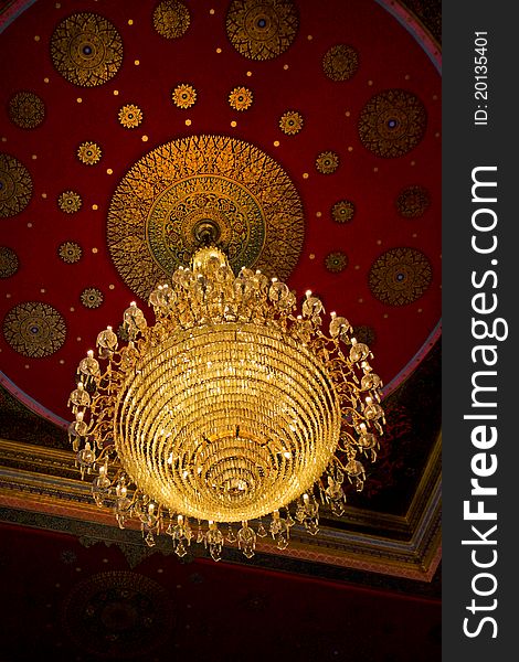 The huge old antique chandelier from the ceiling of a Buddhist temple