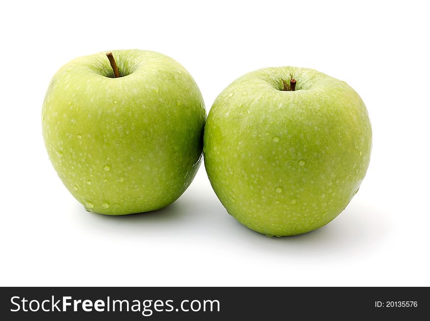 Two ripe green apples isolated on a white background