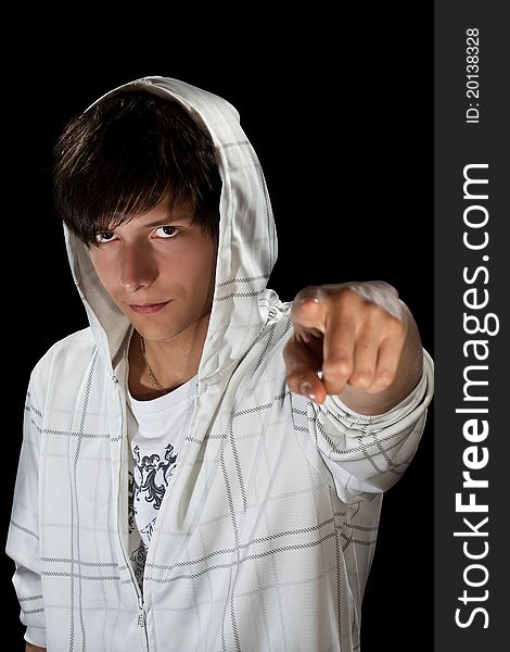 Young stylish man in hood pointing for finger at camera. Young stylish man in hood pointing for finger at camera
