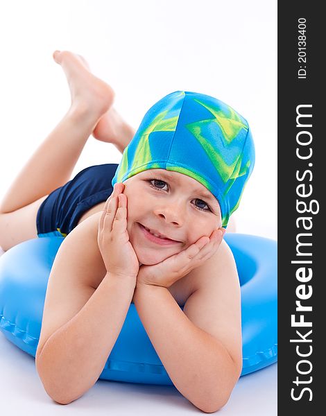 Funny little boy playing with blue life ring in swim caps, isolated in white