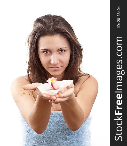 Portrait of beautiful young woman with spring flower