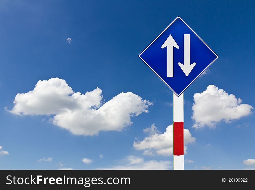 Curved Road Traffic Sign over blue sky