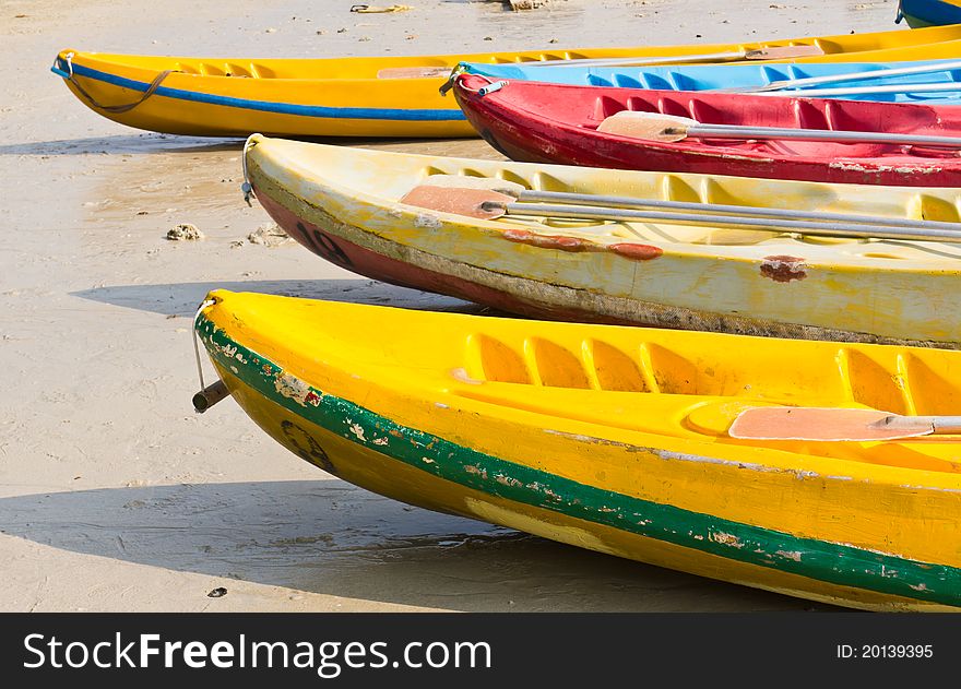 Old Colorful kayaks on the beach