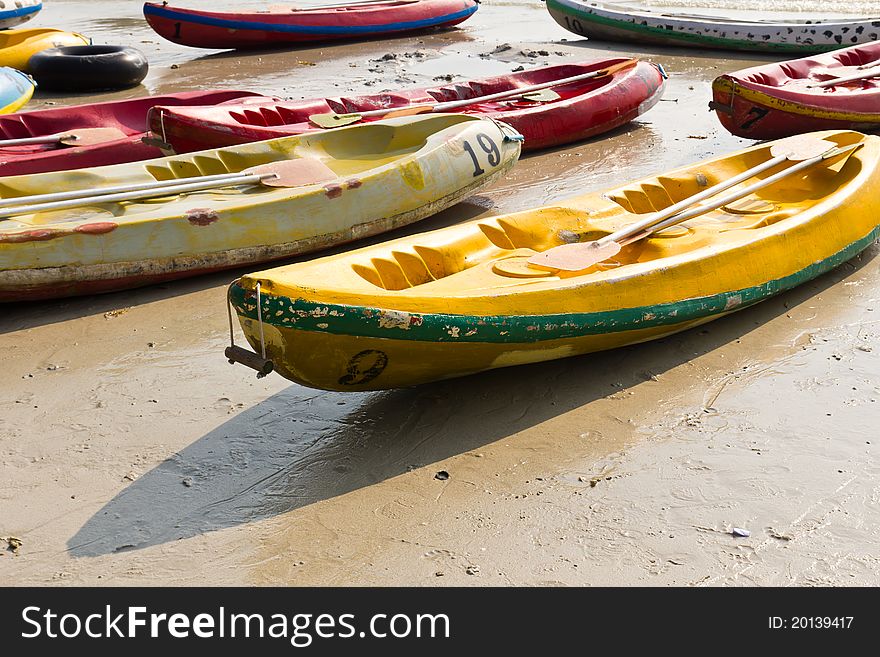 Old Colorful kayaks on the beach