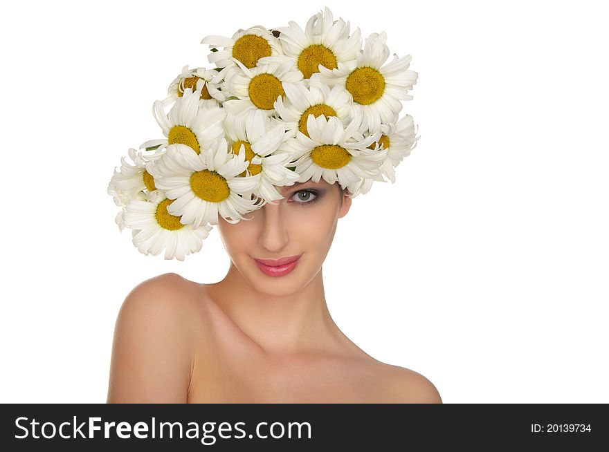 Beautiful woman in the hat of daisies isolated on white
