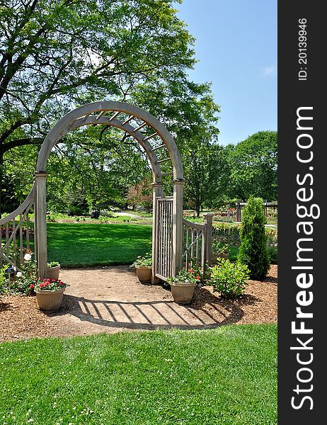 Wooden arch in formal garden. Wooden arch in formal garden