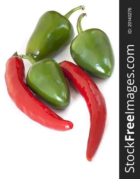 Red and green chili peppers, isolated on white background.
