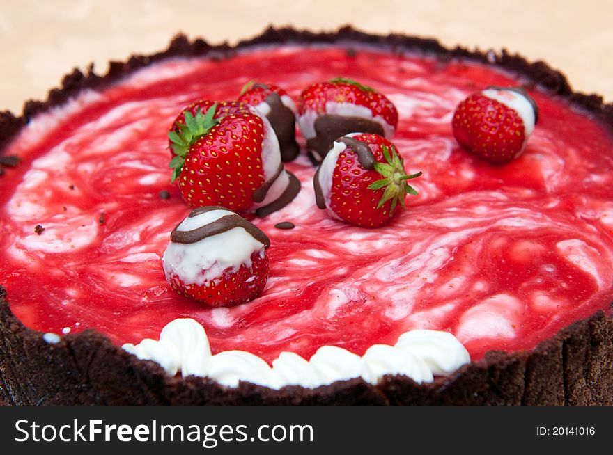 Detail of cake with strawberries and strawberry icing. Detail of cake with strawberries and strawberry icing.