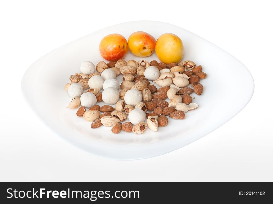 Nuts and apricot on the plate