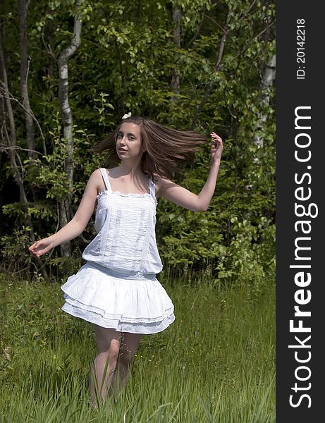 Happy  girl walking in a forest