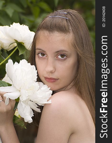 Portrate of pretty young girl with white peony. Portrate of pretty young girl with white peony