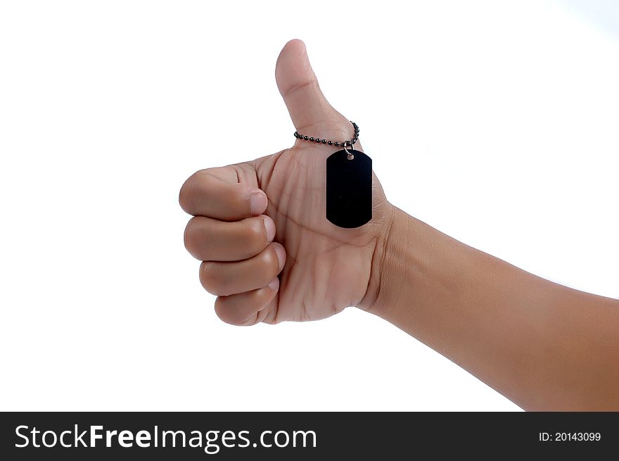 Thumbs up and a black metal blank tag isolated on white background