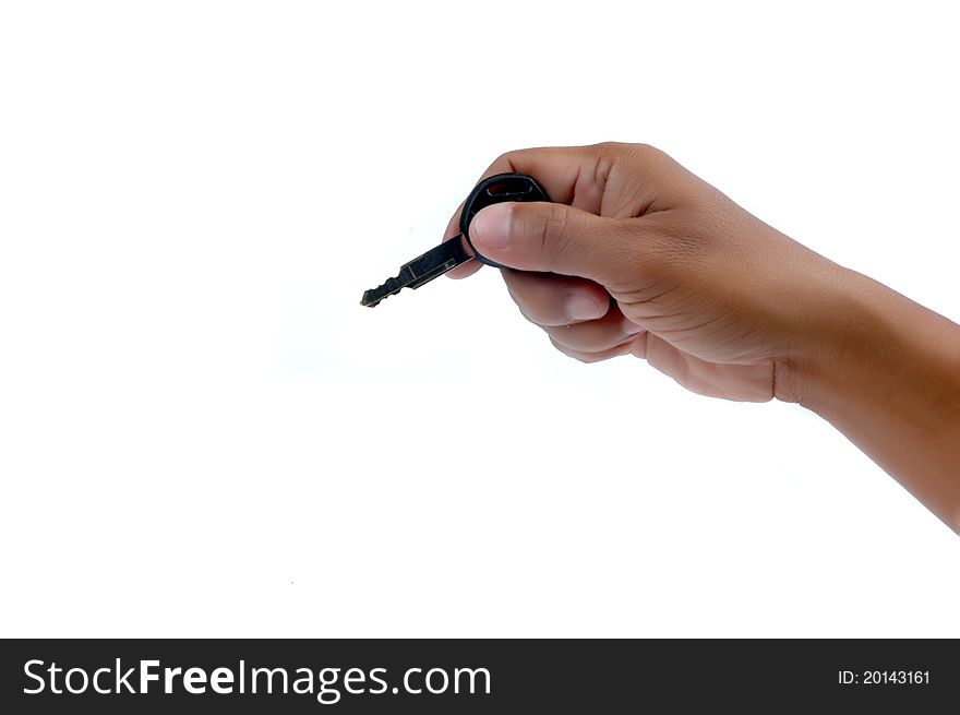 Male hand holding a key isolated on white background