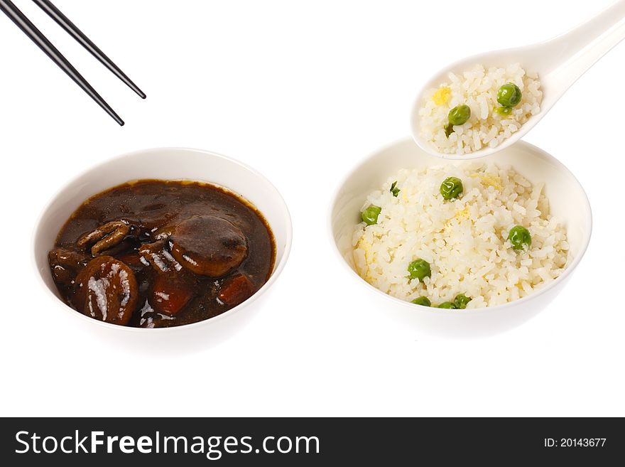 A chinese meal consisting of beef and black bean and fried rice on white back ground