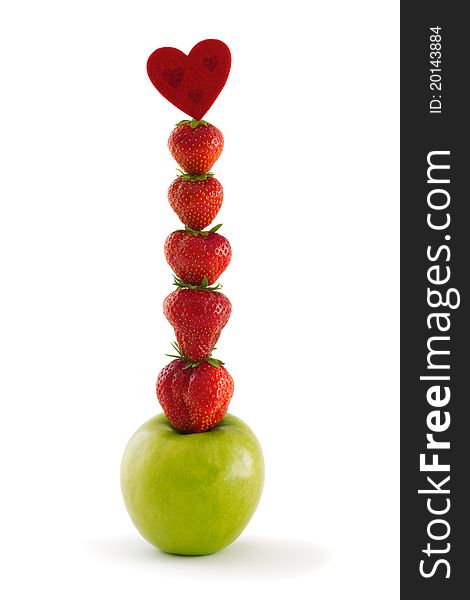 Vertical composition of green apple and ripe vibrant strawberries ending with a red heard elements, isolated on a white background. Vertical composition of green apple and ripe vibrant strawberries ending with a red heard elements, isolated on a white background.