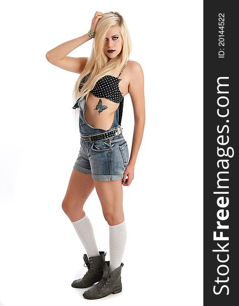Sexy young blonde female in dungarees