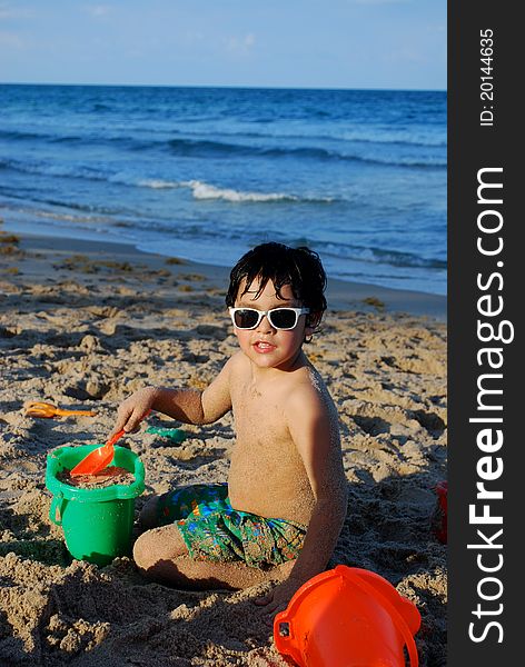 Adorable Hispanic boy by the pool