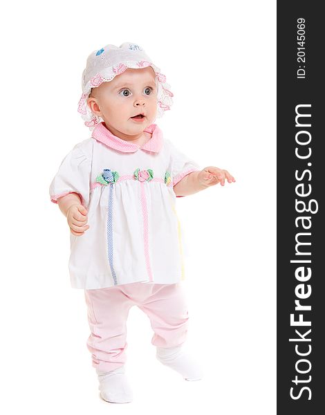 Baby in dress on a white background.