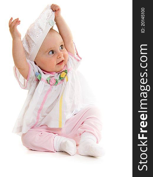 Baby in dress on a white background.