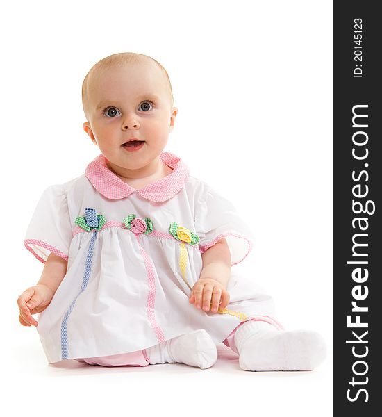 Baby in dress on a white background.