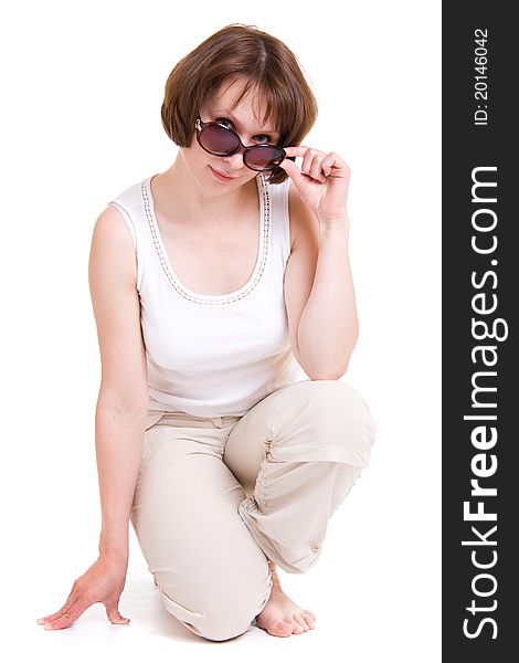 Woman in sunglasses on white background.