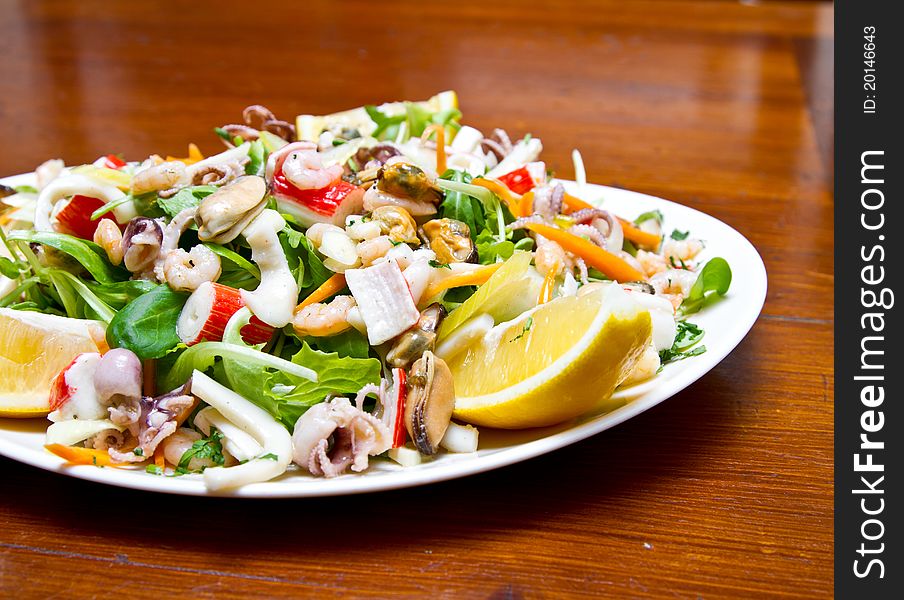 Seafood salad with rucola and lemon juice